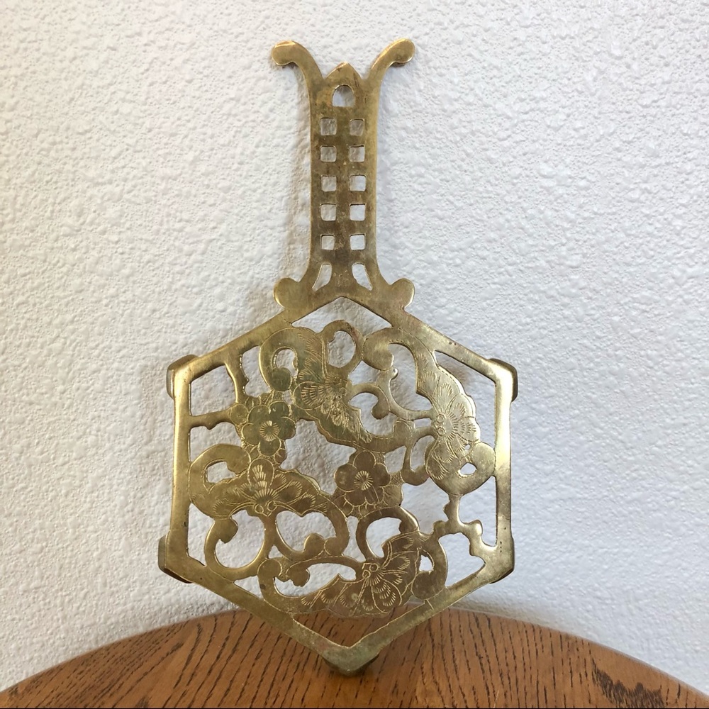 vintage brass trivet with flowers and bees